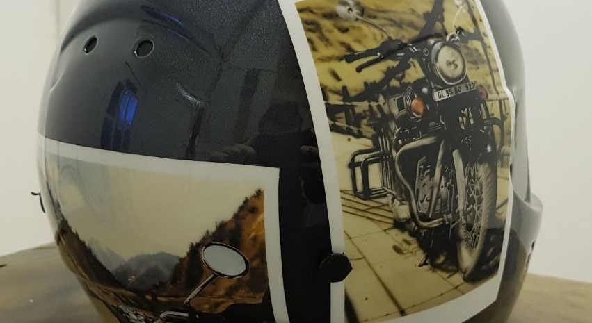 Airbrushed Painting of a Touring Helmet with image of a motorbike on a scenic road paintied like a poleroid photo Close up